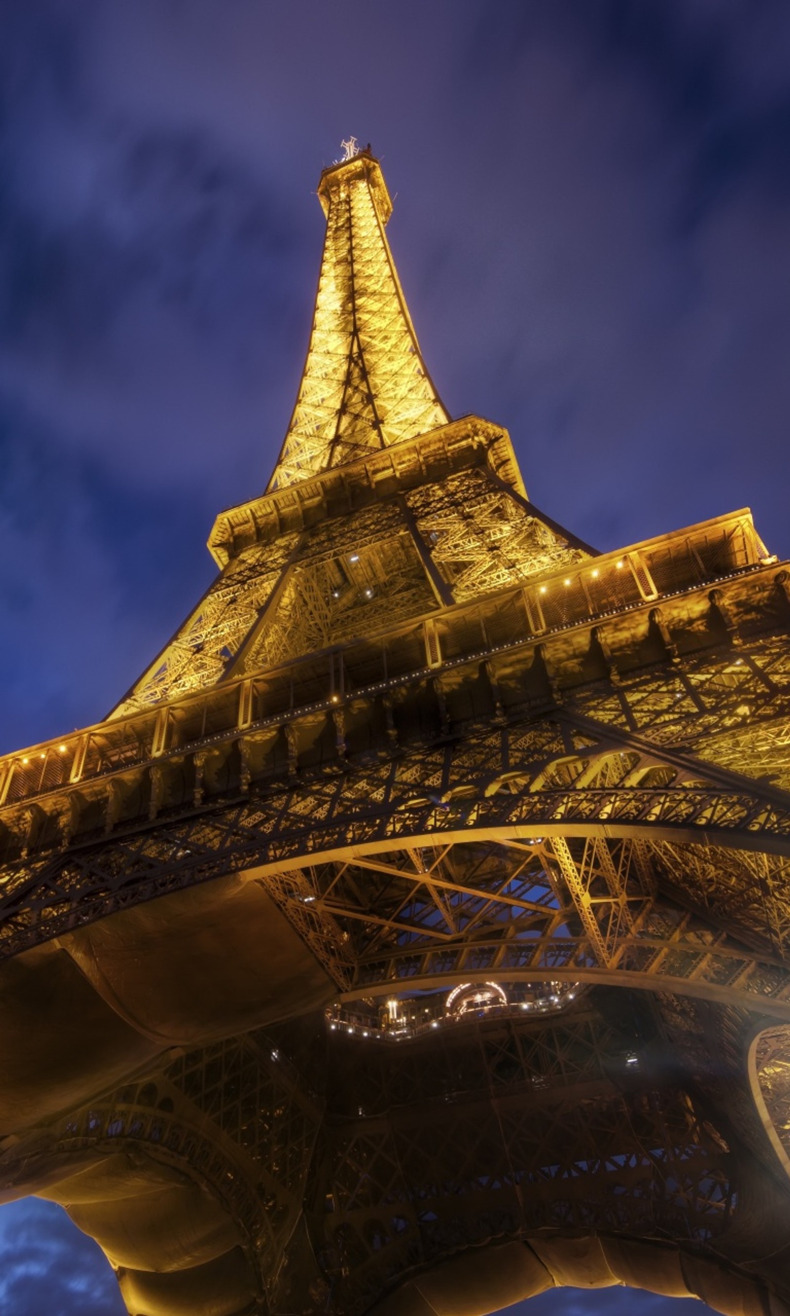 Araffe view of the eiffel tower at night with the lights on (eiffel, france, paris, structure, tower)