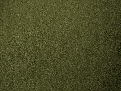 Cuir vert olive texturé ressemblant à des herbes naturelles, évoquant confort et style.