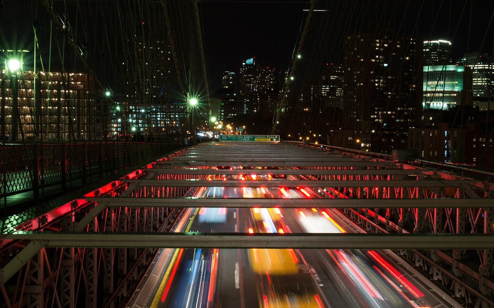 Arafed view of a city at night with a bridge and cars (night, metropolis, urban area, light, city)