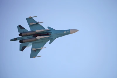 Sukhoi Su-34 Fighter Jet in Flight Against a Clear Sky