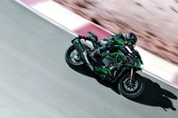 Kawasaki Z H2 SE in action on the race track, showcasing its dynamic design and performance.