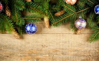 Festive Evergreen Branches with Colorful Ornaments and Pinecones