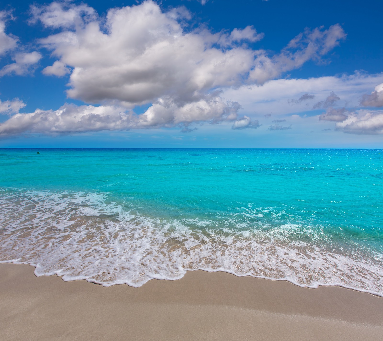 Arafly view of a beach with a blue ocean and a few clouds (beach, nature, sea, tropical, waters)