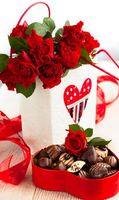 Regalo romántico de rosas rojas y delicias de chocolate