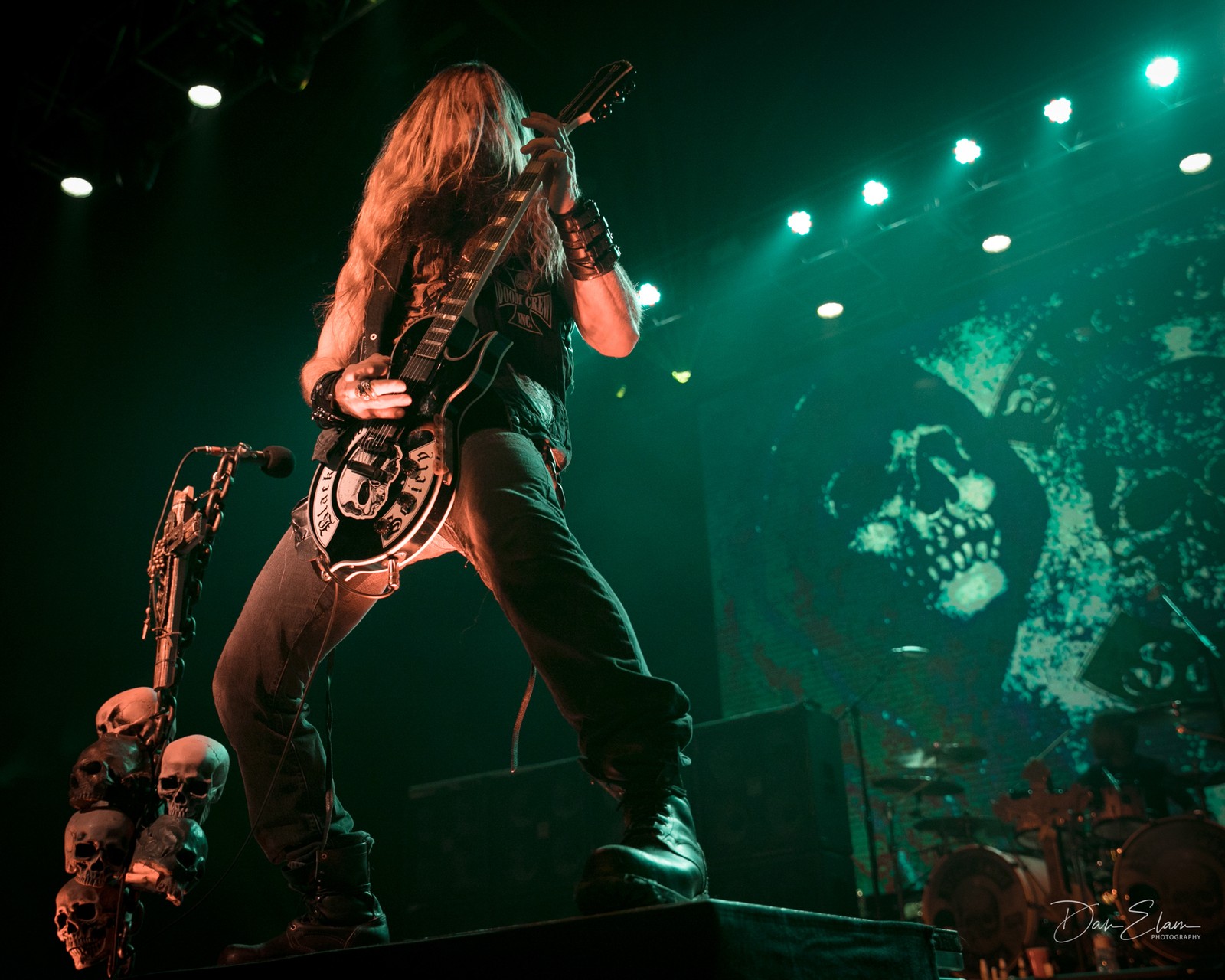 Arafed man with a guitar on stage with a microphone (stage, rock concert, performance, entertainment, music artist)