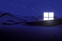 Logotipo do Windows iluminado em uma noite desértica com trilhas de estrelas