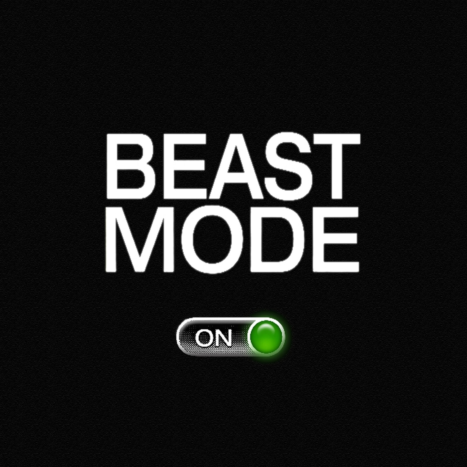 A close up of a button on a black background with the words beast mode (beast, mode, switch)