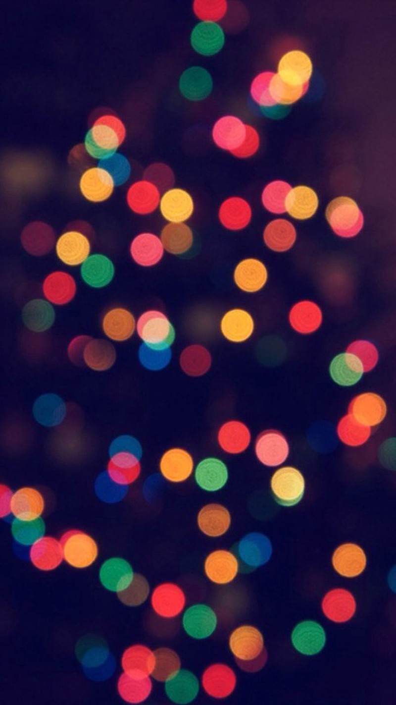 A close up of a christmas tree with many lights on it (colors, tree)