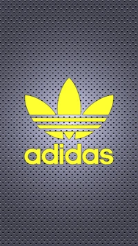 Logo Adidas jaune sur un fond gris texturé.