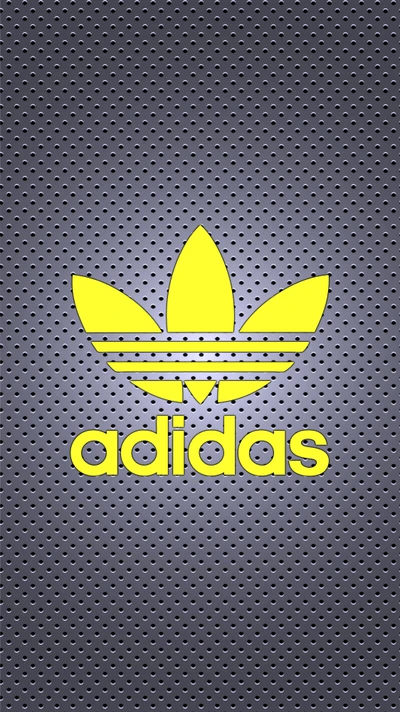 Logo Adidas jaune sur un fond gris texturé.