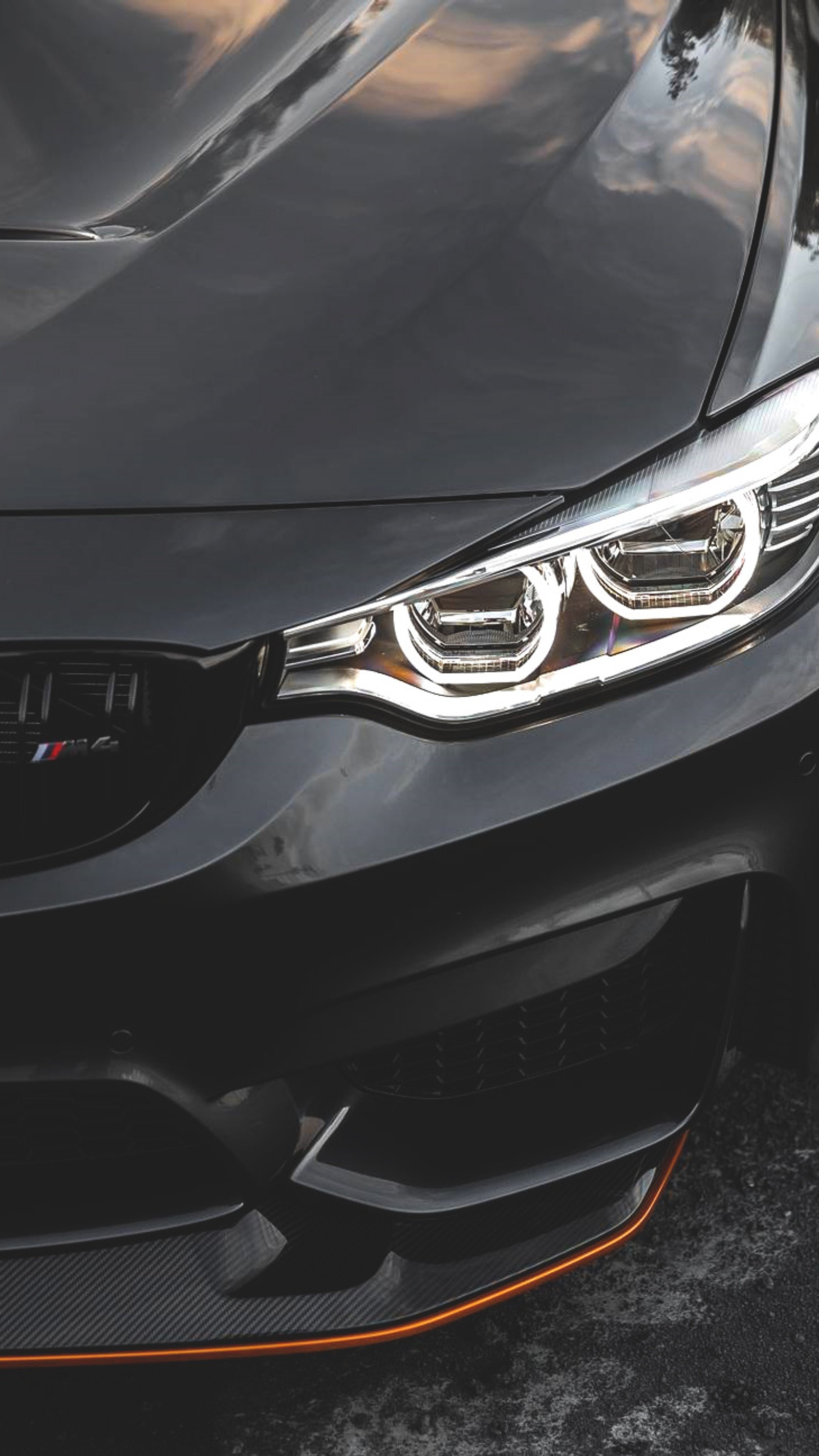 Un primer plano de un coche bmw con un faro brillante (bmw, coche, amor, tuning)