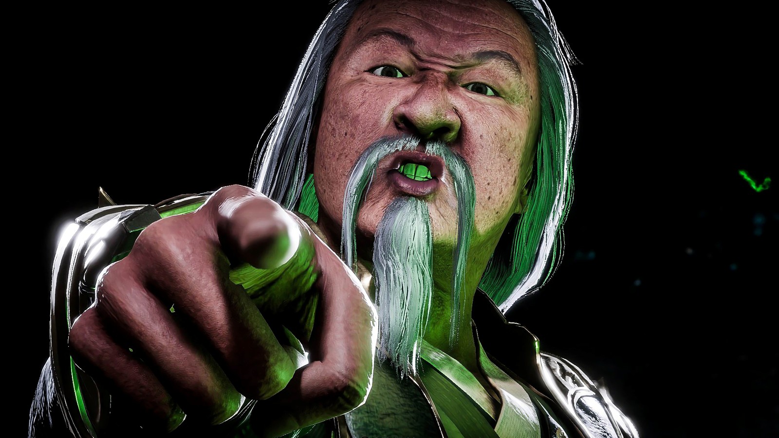 Un hombre árabe con cabello verde y barba señalando algo (shang tsung, mortal kombat 11, videojuego)