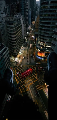 Urban Skyline at Dusk: Skyscrapers and Cars Illuminated in City Intersection