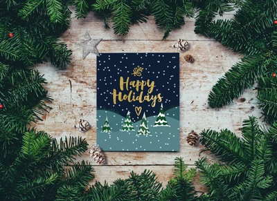 Festive 'Happy Holidays' Greeting Card Surrounded by Pine and Snowflakes