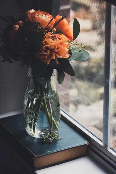 Vibrant Flower Bouquet in a Glass Vase by the Window