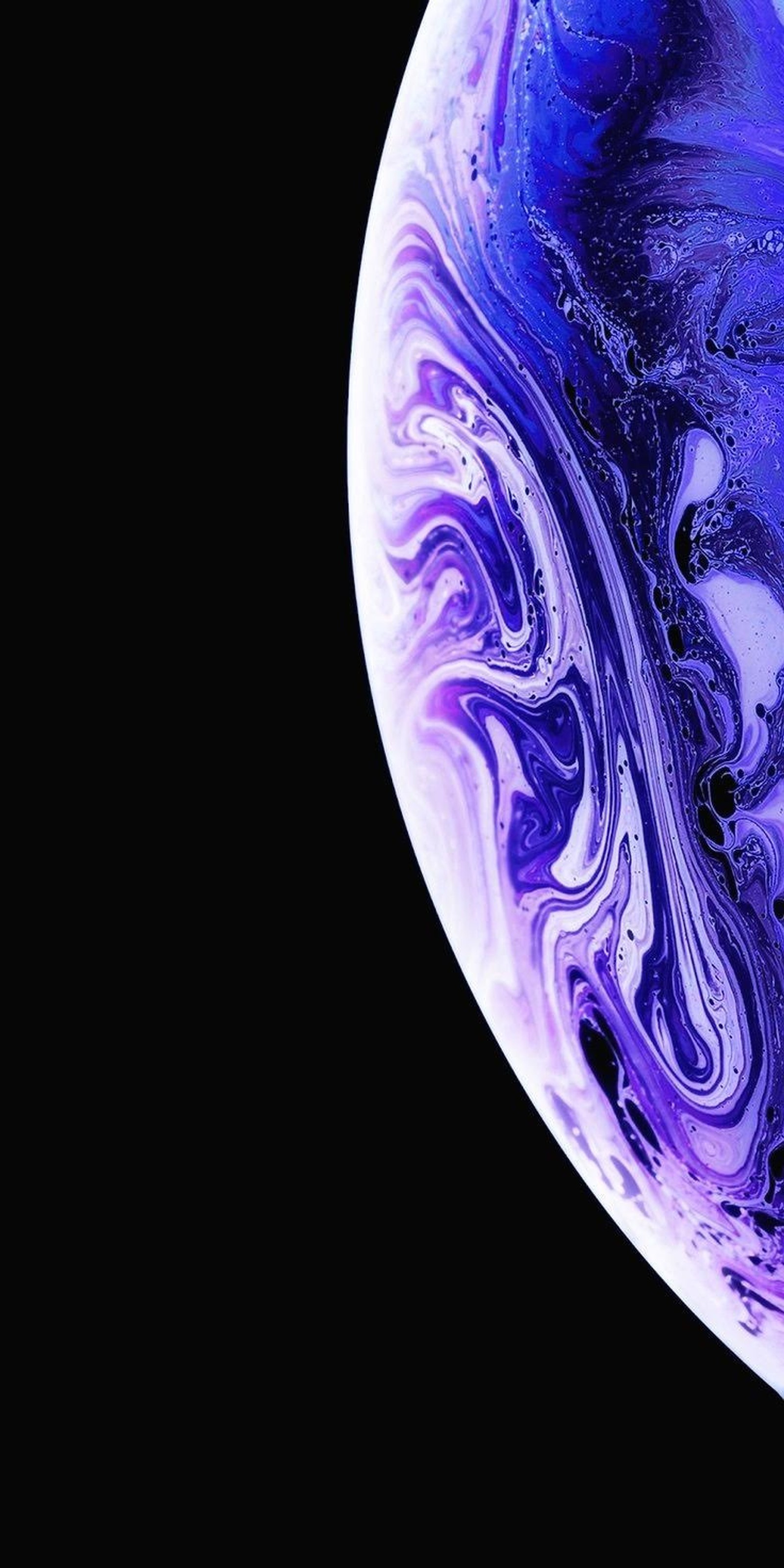 A close up of a purple and blue marbled iphone (iphone, iphone xs, apple, earth, edge)