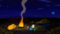 Jake y Finn disfrutando de una fogata bajo las estrellas