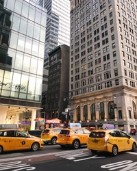 Yellow Cabs in a Bustling Urban Scene