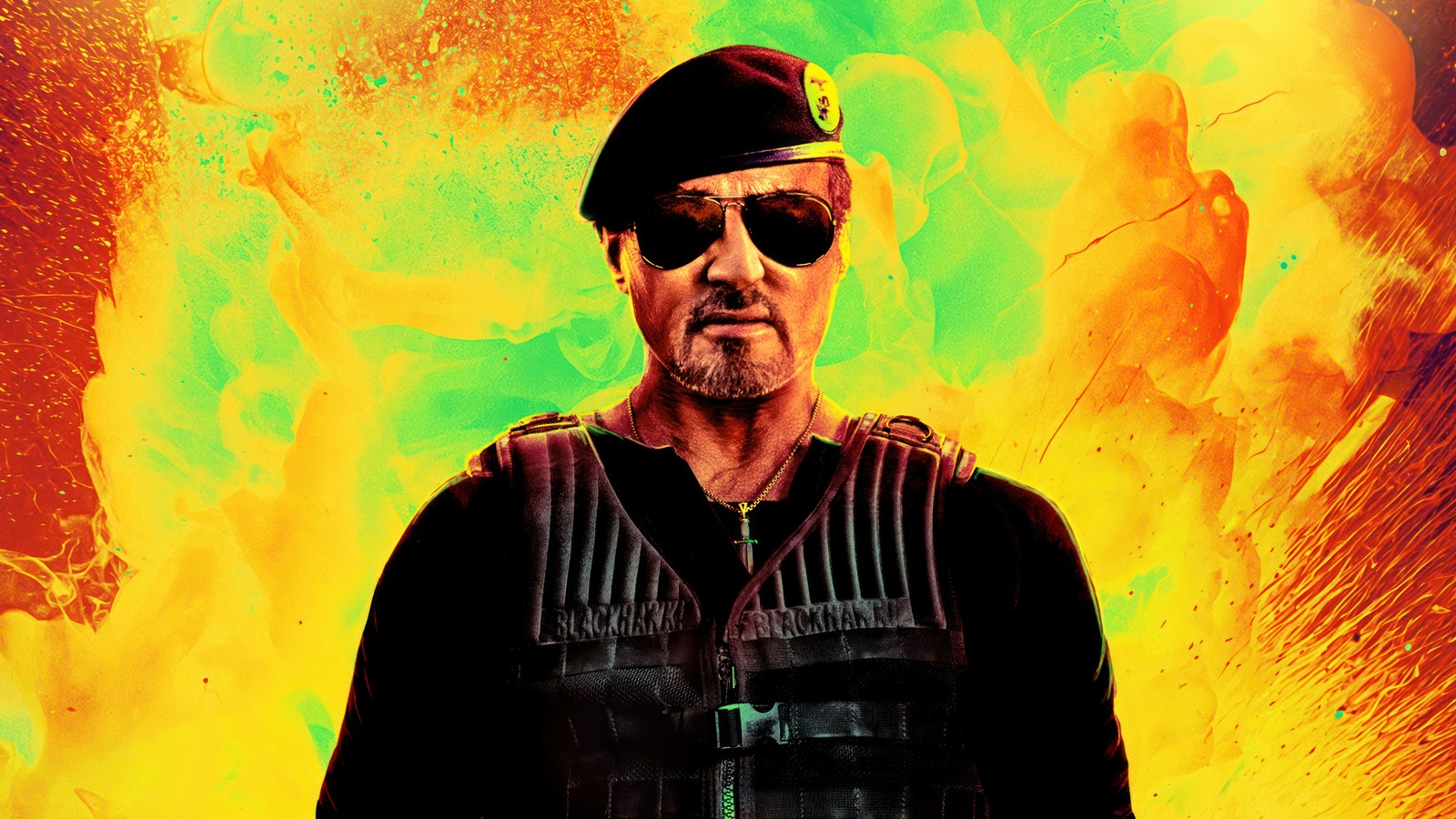 A man in a black vest and hat standing in front of a yellow and green background (expendables 4, expend4bles, movie, 2023)