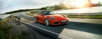 Porsche 718 Boxster em movimento: uma mistura dinâmica de desempenho e elegância nas estradas costeiras.