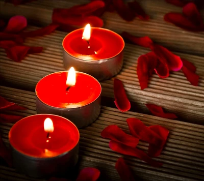 Red Candles Surrounded by Petals