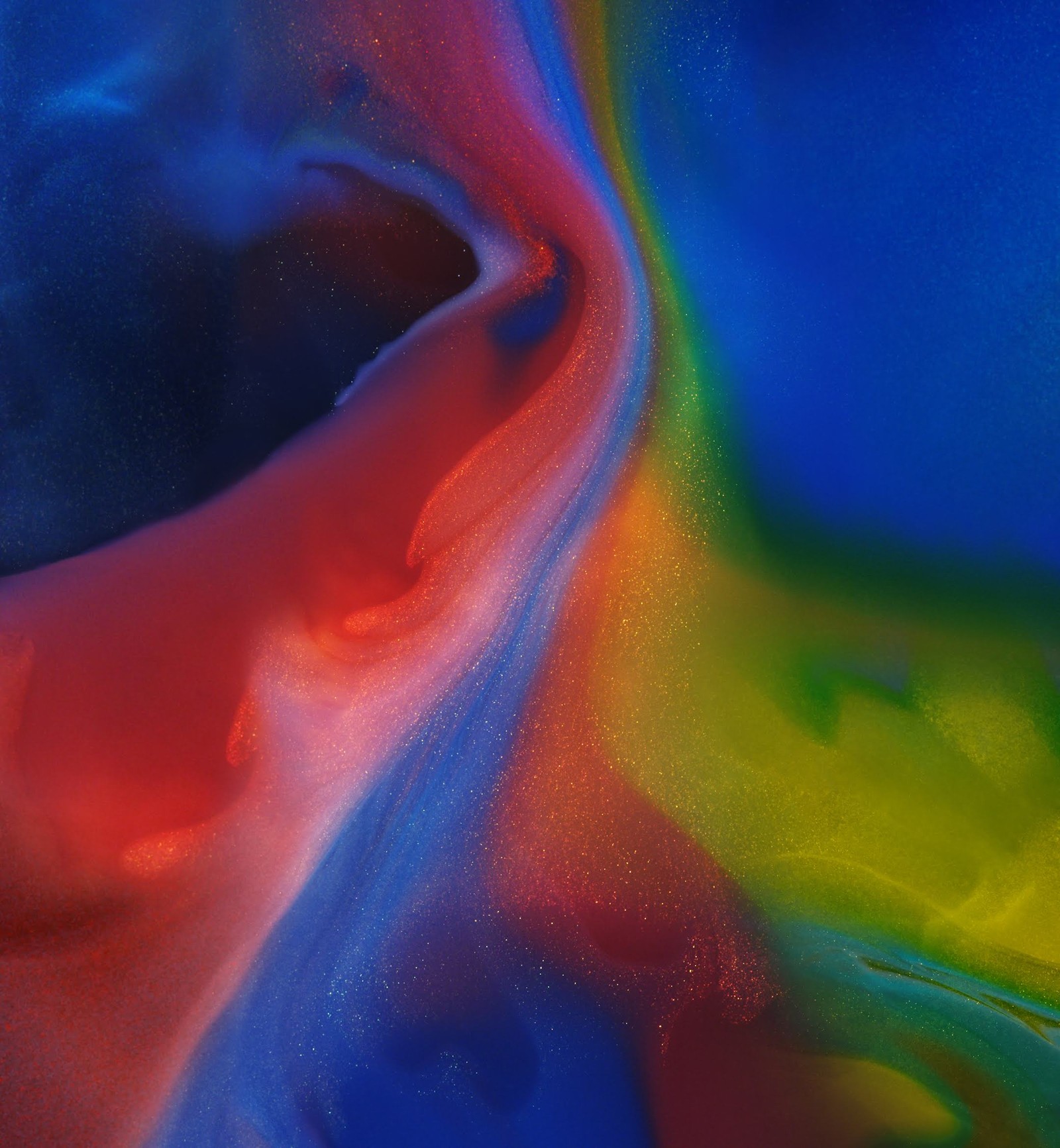 Brightly colored liquid pouring into a glass container with a blue background (huawei, honor magic 2, smartphone, android, blue)