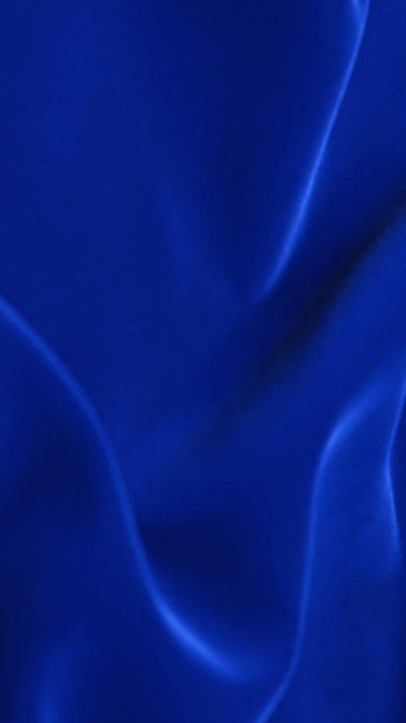 A close up of a blue cloth with a white background (blue, dark)