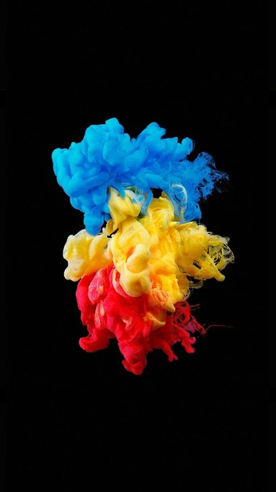 Vibrant Smoke Swirls in Blue, Yellow, and Red Against a Black Background