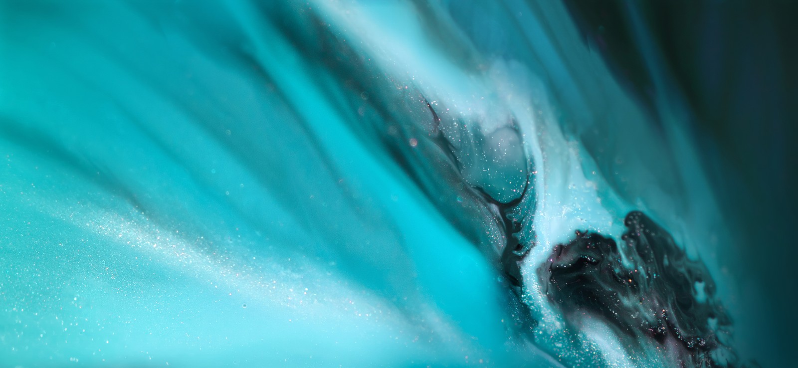 A close up of a blue and black water wave with a black background (vivo nex, stock, android 10, teal, turquoise)