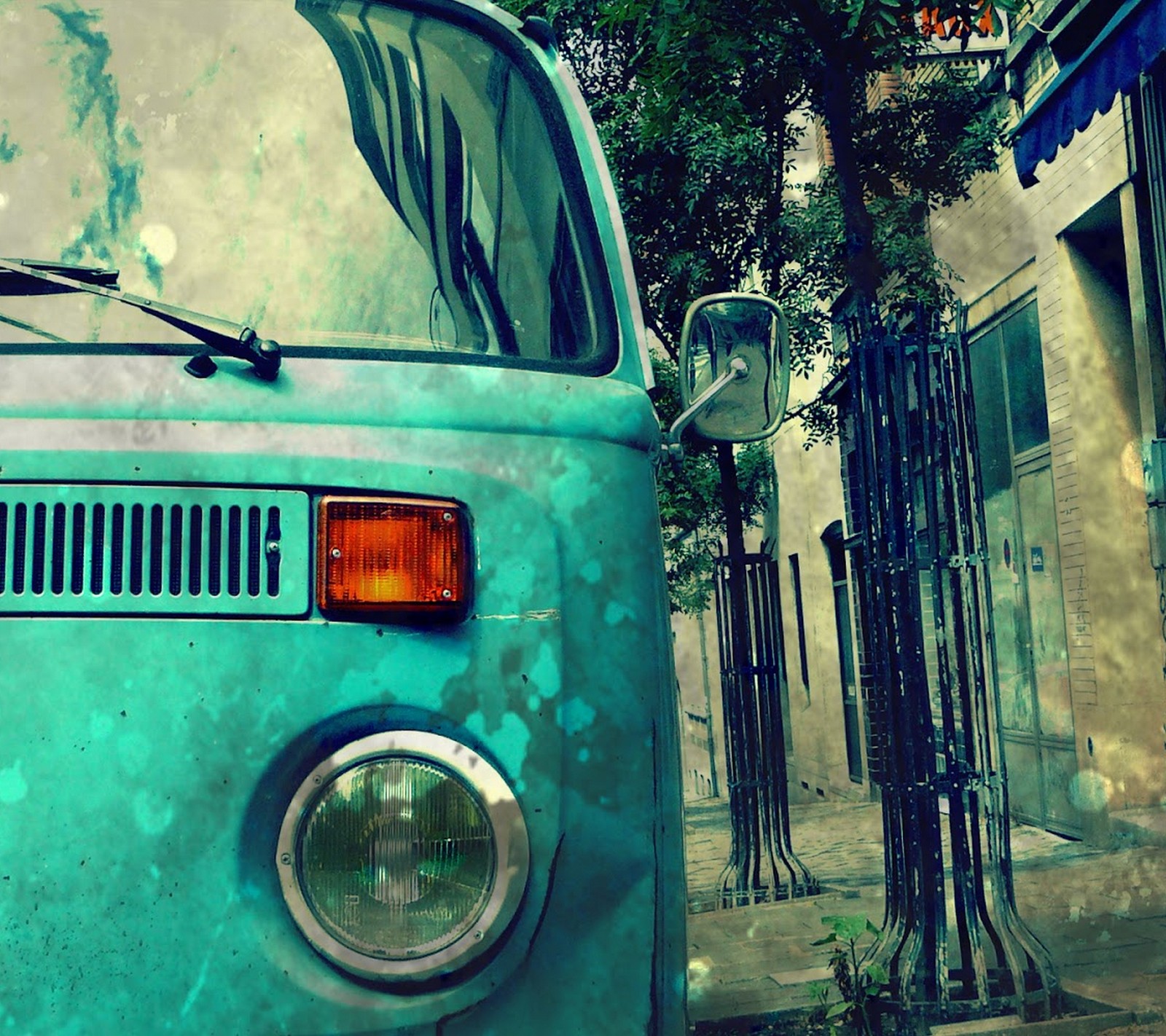 There is a blue van parked on the side of the street (auto, awesome, car, cool, old)