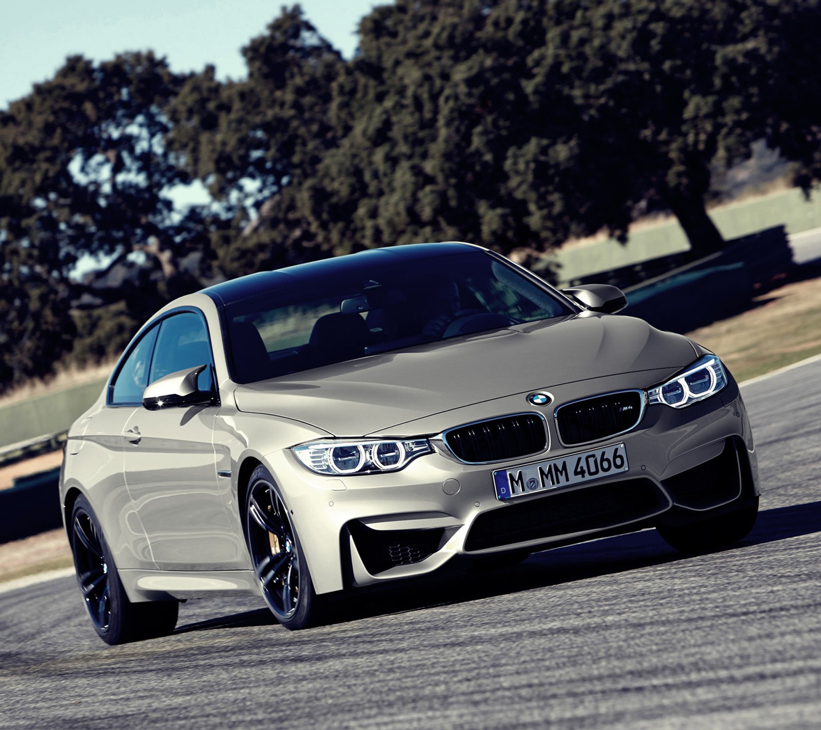 A close up of a bmw car driving on a track (bmw, coupe, f82, m power, m4)