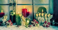 Festive Christmas Window Display with Ornaments, Candles, and Angels