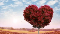 Árbol en forma de corazón en un paisaje vibrante