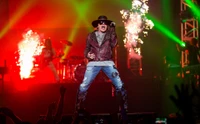 Axl Rose captivates the audience with an electrifying performance at a Guns N' Roses rock concert, surrounded by vibrant lights and pyrotechnics.