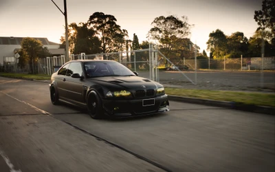 Modified Black BMW Racing Through Urban Streets