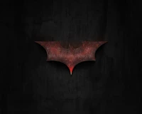 Logo de Batman oxidado sobre fondo oscuro