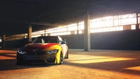 BMW M4 GT4 in an industrial setting, illuminated by dramatic lighting.