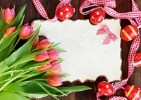 Colorful Easter eggs surrounded by vibrant tulips on a decorative tabletop, perfect for celebrating the holiday.