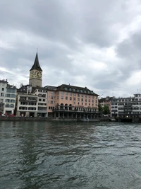 Charming City Facade Along the Waterway with Clock Tower