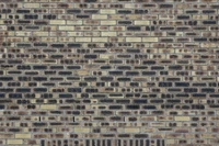 Textured Brickwork Wall with Varying Patterns and Colors