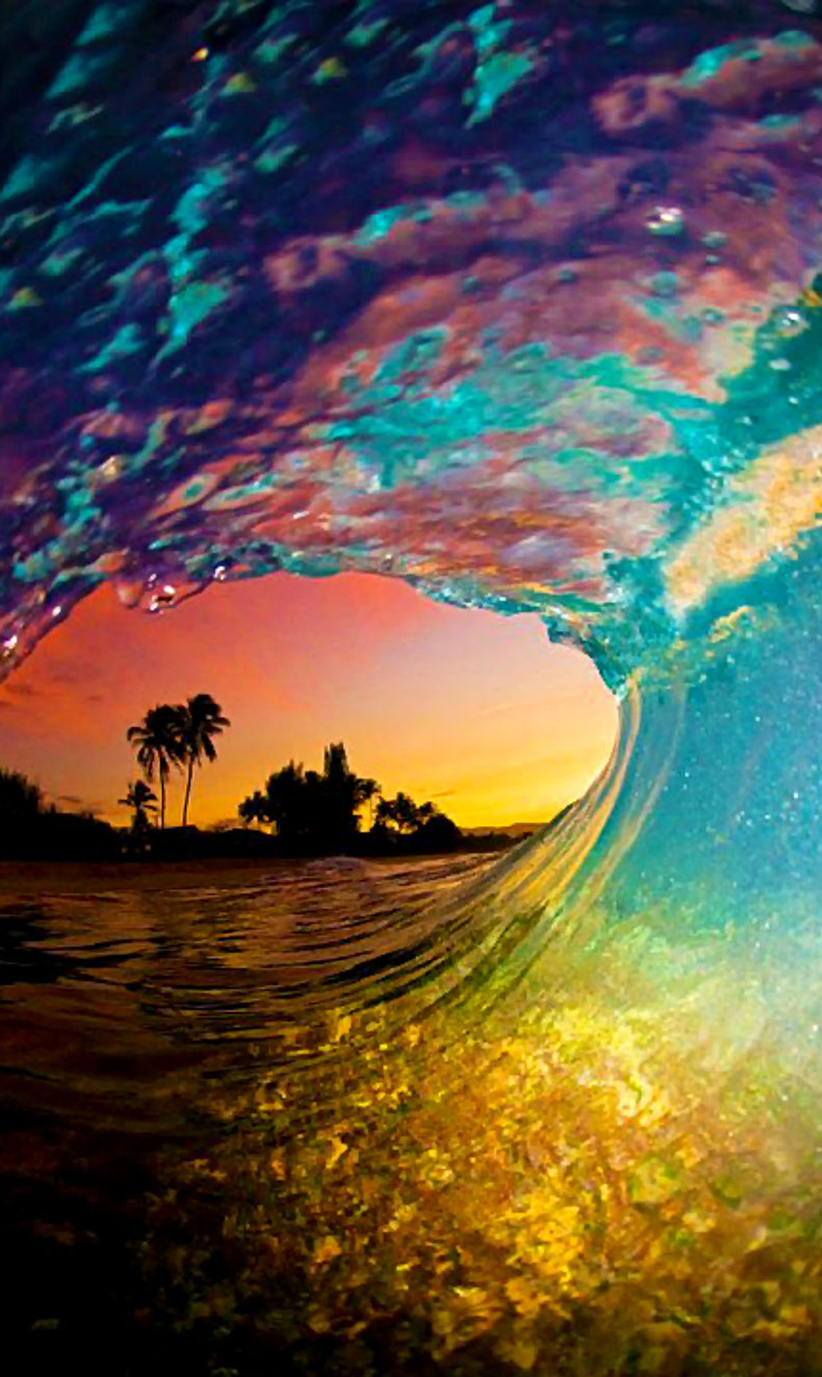 A close up of a wave with a sunset in the background (beach, colorful, colors, ocean, sunrise)