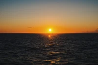 Tranquil Sunset Over the Calm Ocean Horizon