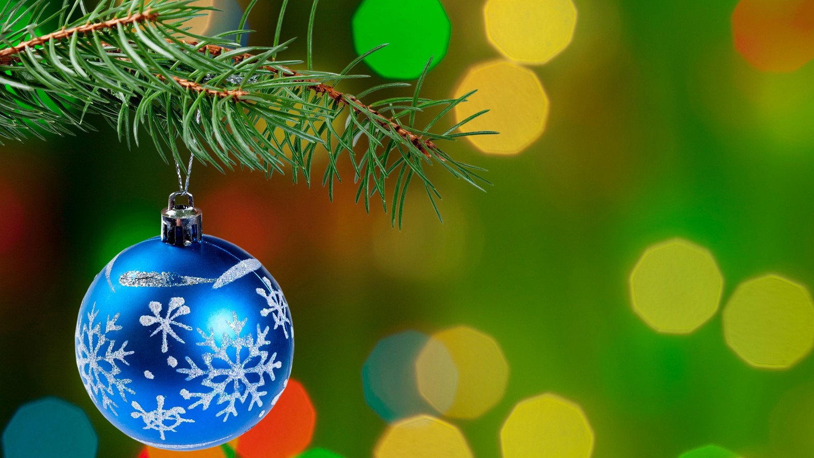 A close up of a blue christmas ornament hanging from a tree (christmas day, christmas tree, christmas ornament, green, christmas decoration)