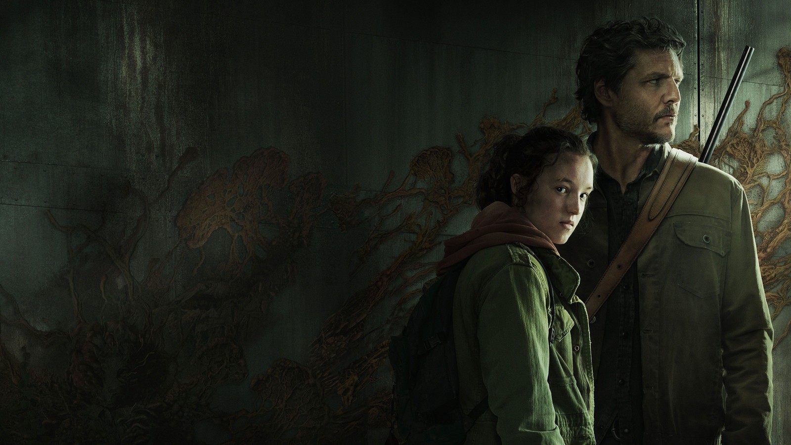 A man and woman standing next to each other in a dark room (the last of us, pedro pascal as joel, bella ramsey as ellie, joel miller, ellie williams)