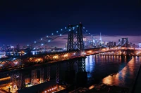 Nighttime Cityscape Featuring Williamsburg Bridge and New York City Skyline