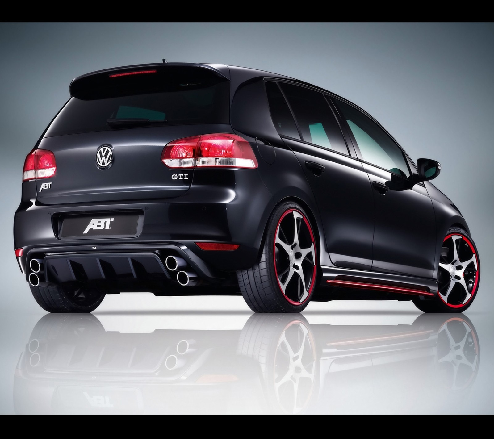 A black volkswagen golf r - line with red accents and a rear bumper (abt, auto, car, golf, tuning)