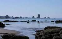 Serene Coastal Landscape with Rocky Formations and Calm Waters