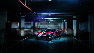 Roter Ford GT Supersportwagen in dramatischer Beleuchtung in einer Parkgarage