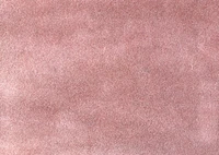 Surface en cuir texturé rose et marron avec un motif subtil semblable à du velours.