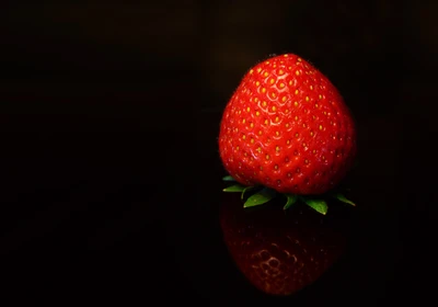 Fresh Strawberry Glowing Against a Dark Background